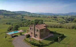 Podere casale Tuscany garden and pool with rolling hills in the background
